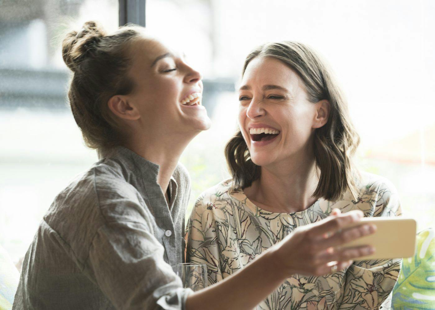 Two Women Laughing I Stock 504880486