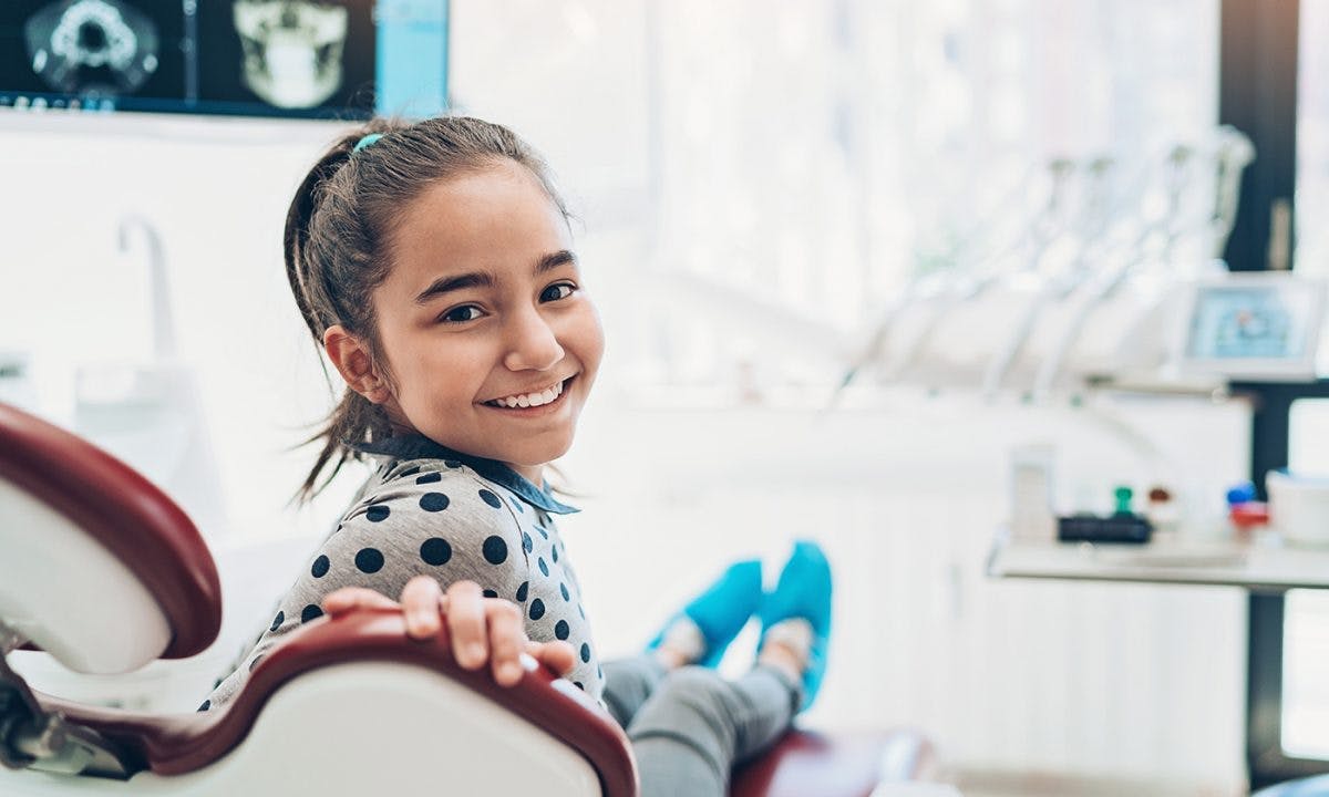 Young Girl In Dentist Chair