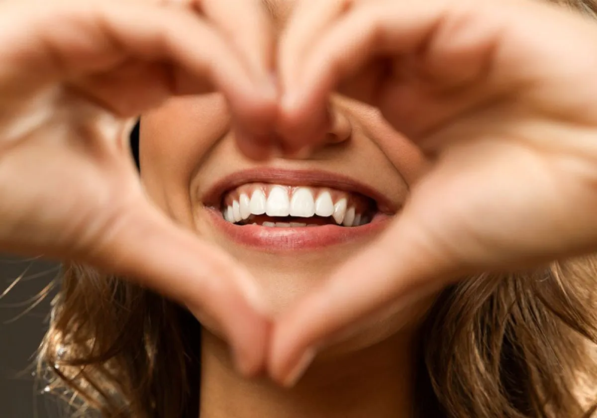 Woman Smiling Hearth Shaped Hands